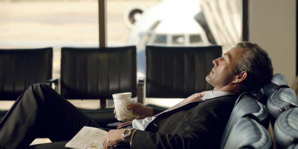 a man sleeping in th airport