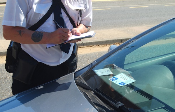 Parking warden issues a fine but parking ticket appeals are on the rise