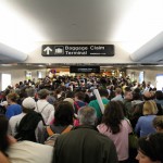 People walk through busy terminal