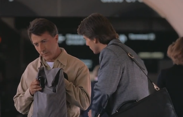 This smart fellow is causing his brother all kinds of grief in this airport movie scene