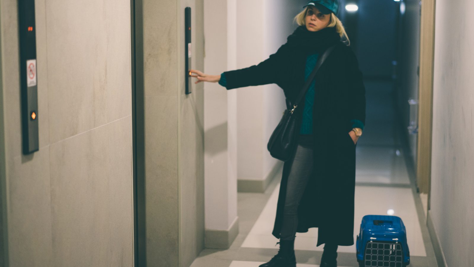 a woman with a pet carrier